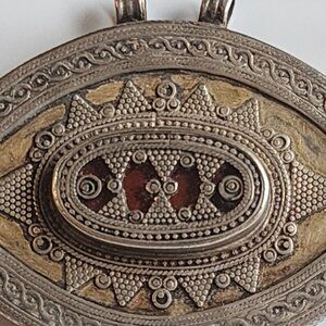 Silver-eye shaped amulet from North Africa , Middle East , Asia 2.5 x 1.5 inches